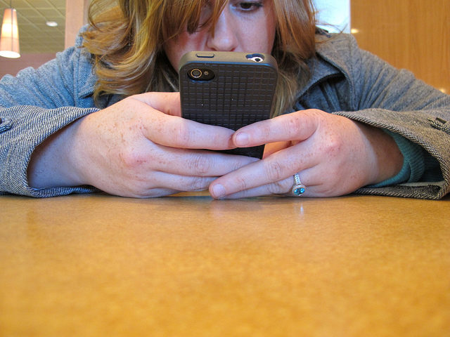 Image: on the phone by BuzzFarmers via flickr (https://www.flickr.com/photos/buzzfarmers/7317967922/)